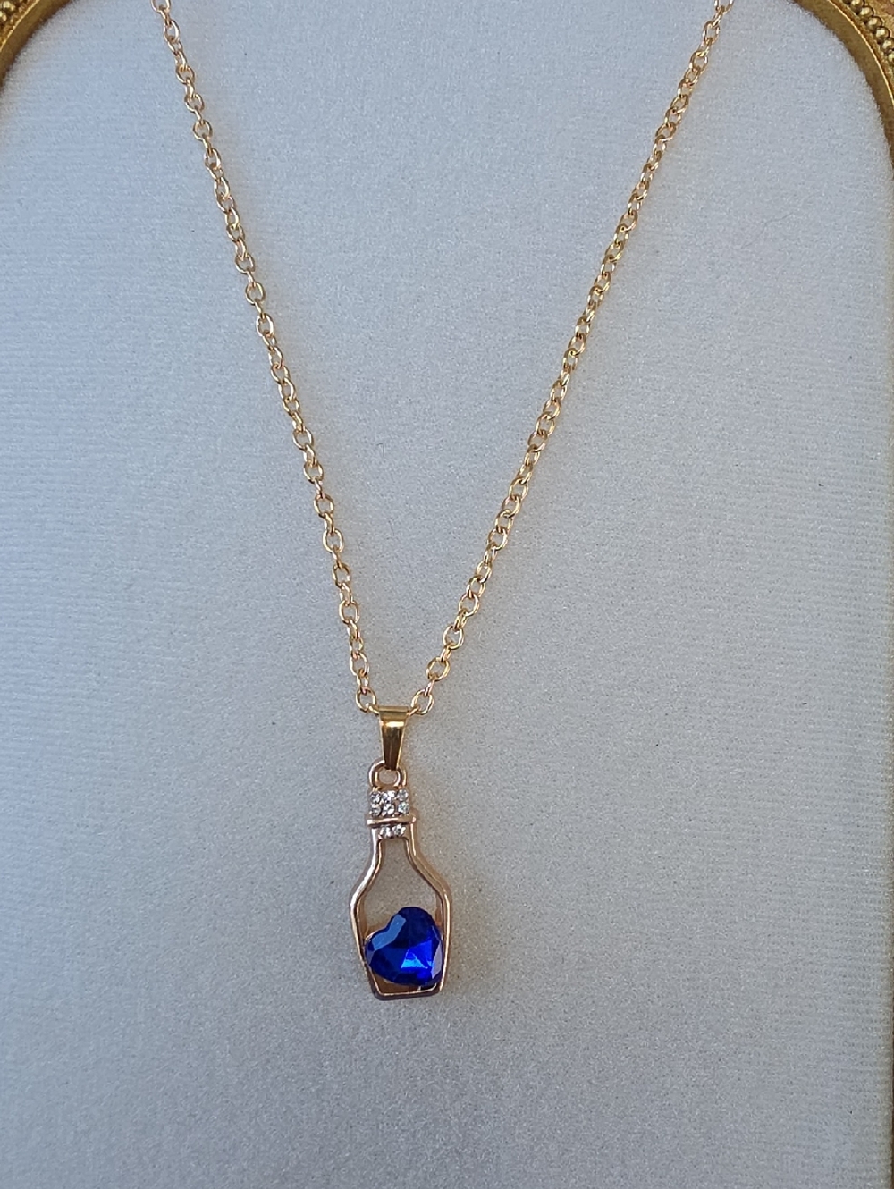 Gold Toned Necklace with Blue Heart Pendant